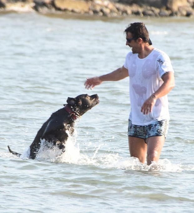 Ibrahim Celikkol played with his dog Jozi at sea
